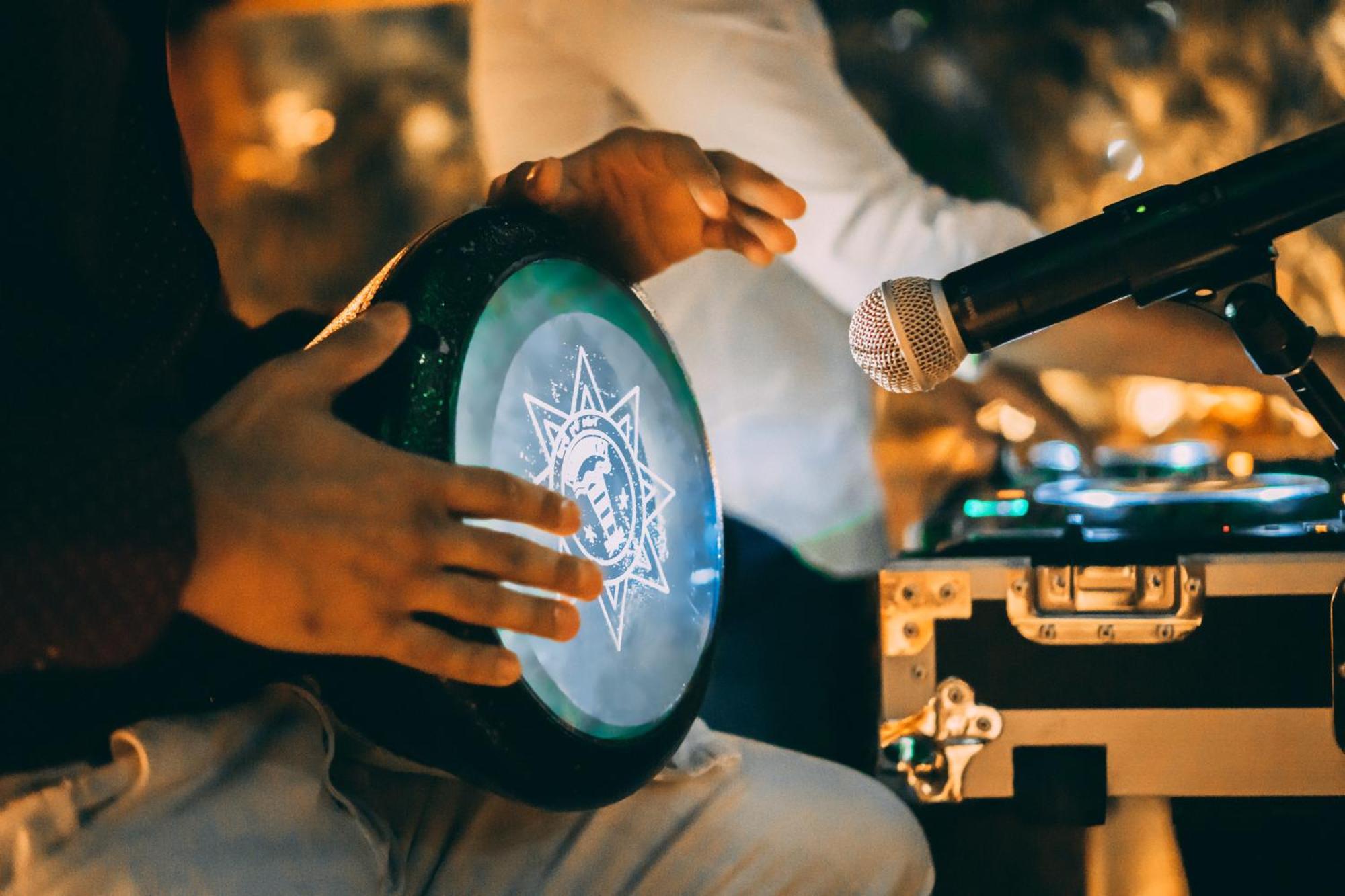 Jumeirah Emirates Towers Dubai Exterior photo A musician playing a tambourine
